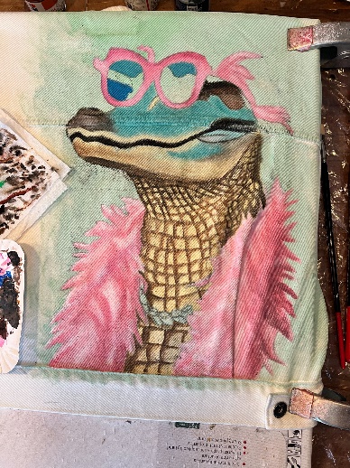 Closeup of hand-painted crocodile on jacket back