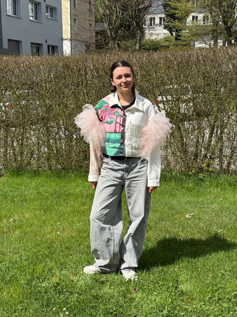 Jana Menzi wearing the finished crocodile jacket outdoors